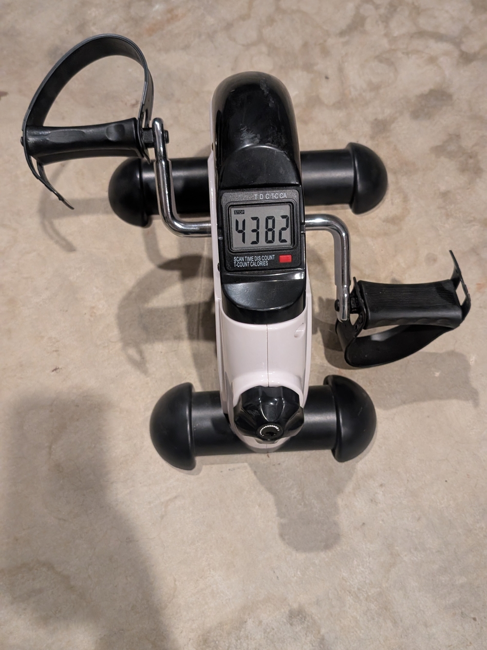 Compact Under-Desk Pedal Exerciser in Black and White